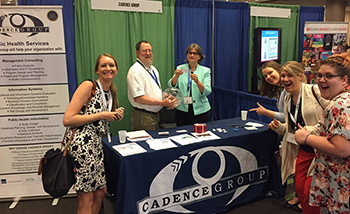 Cadence Group Staff at Conference Booth