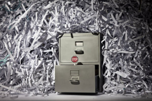 File cabinet surrounded by shreds of paper